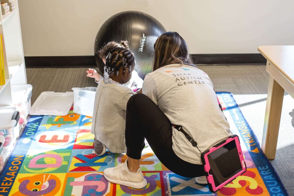 staff with children during therapy